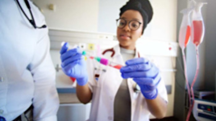 female scientist evaluating a sample