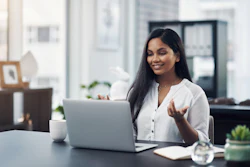 Woman communicating via web cam