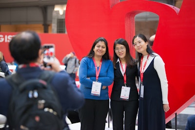 attendees posing for a picture in the heart hub