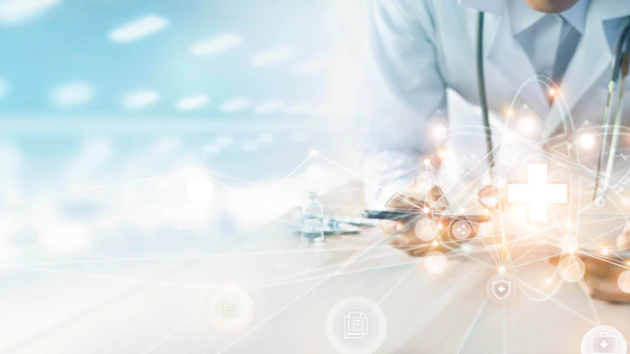 Graphic of doctor leaning forward with light symbols coming out