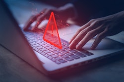 Caution sign on laptop