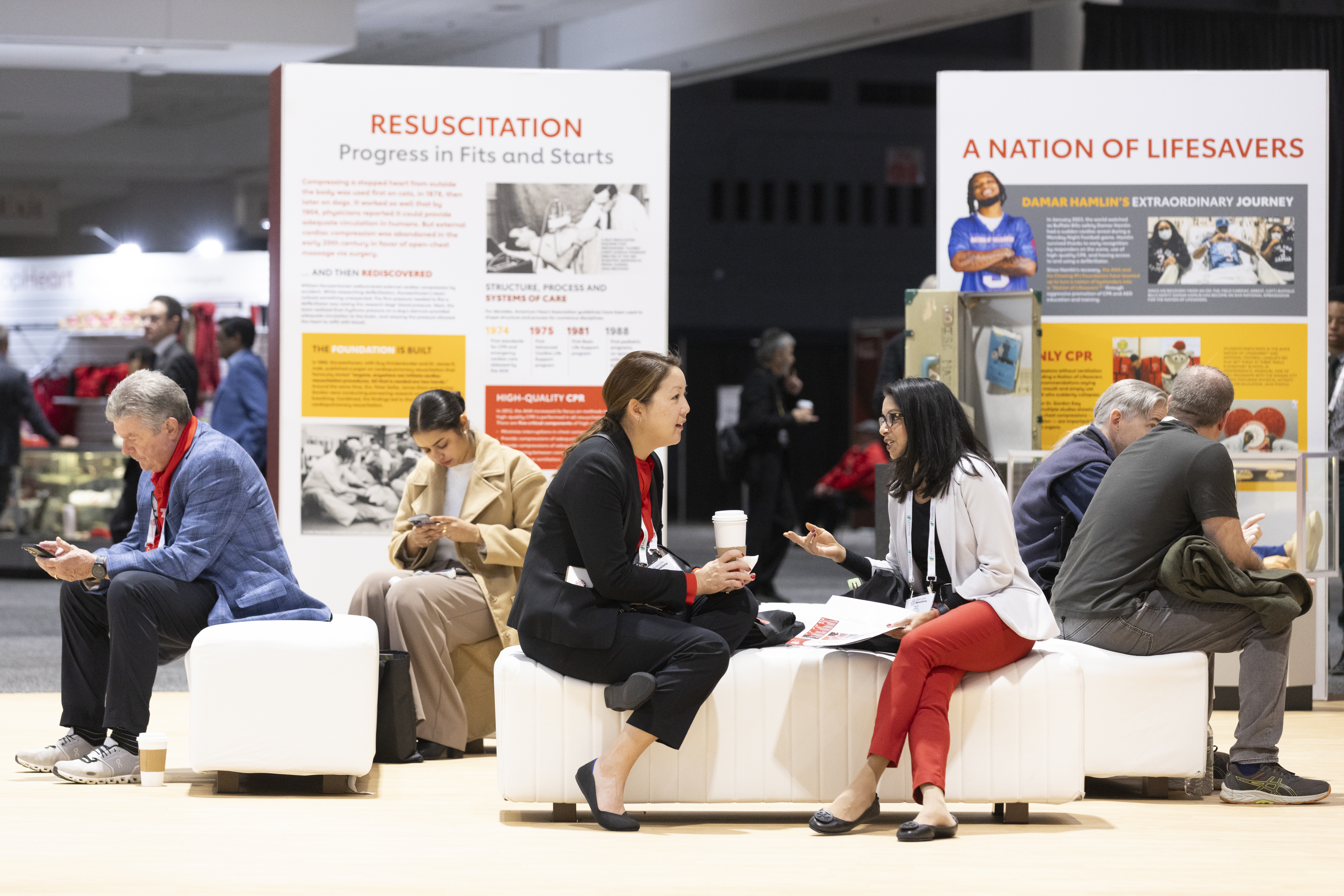 Visitors engage at museum exhibition featuring medical history displays on resuscitation and lifesaving techniques